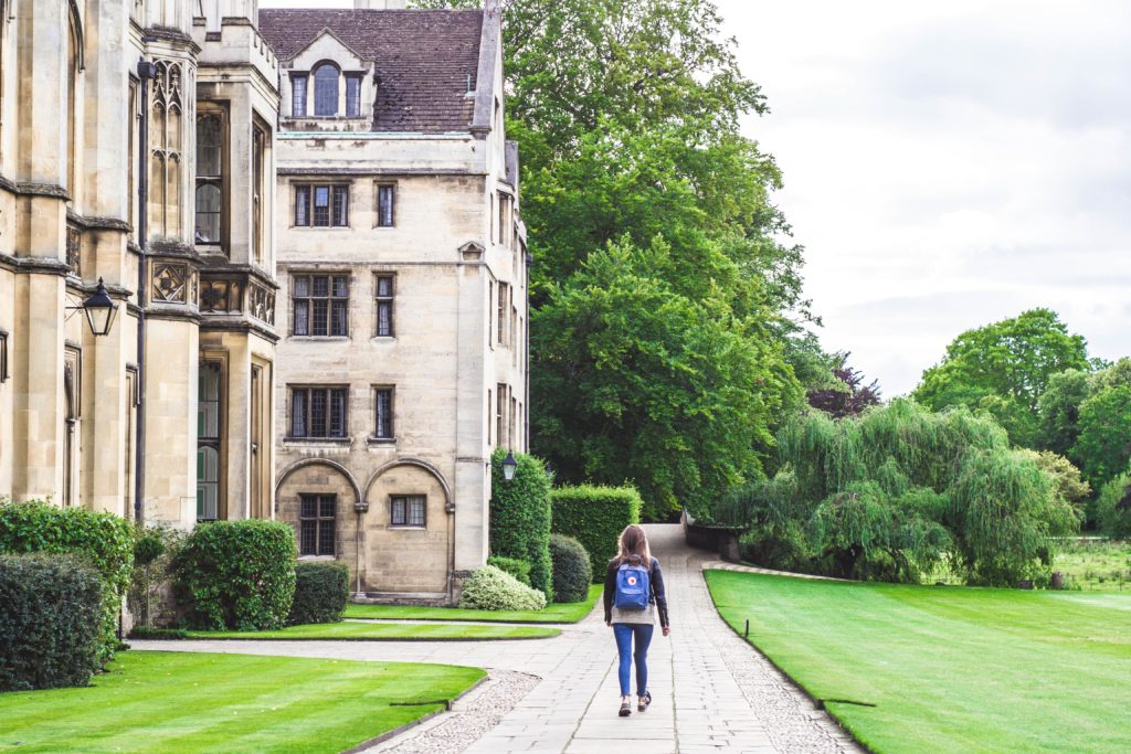 Student walking around campus in Cambridge